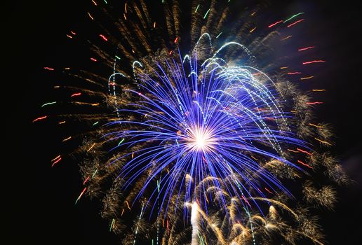 fireworks lighting the night sky in different colors