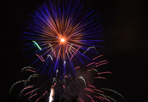 fireworks lighting the night sky in different colors