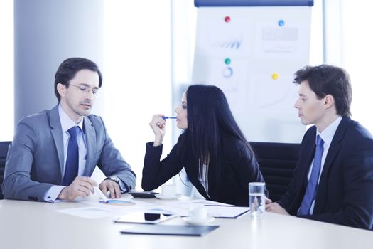 Business people discussing financial reports during a meeting