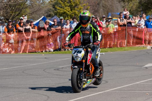 VICTORIA/AUSTRALIA - SEPTEMBER 2015: Stunt motorcycle rider performing at a local car show on the 13 September 2015 in Corowa.