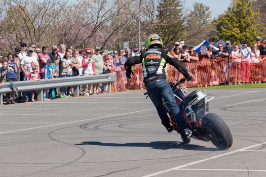 VICTORIA/AUSTRALIA - SEPTEMBER 2015: Stunt motorcycle rider performing at a local car show on the 13 September 2015 in Corowa.