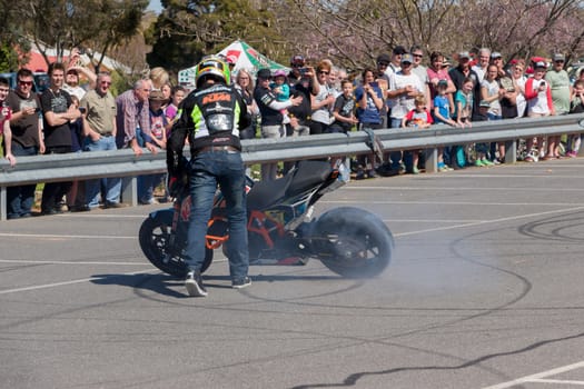 VICTORIA/AUSTRALIA - SEPTEMBER 2015: Stunt motorcycle rider performing at a local car show on the 13 September 2015 in Corowa.