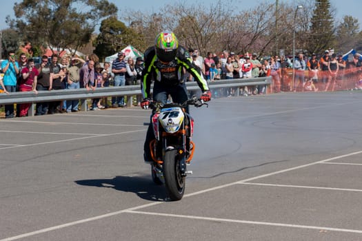 VICTORIA/AUSTRALIA - SEPTEMBER 2015: Stunt motorcycle rider performing at a local car show on the 13 September 2015 in Corowa.