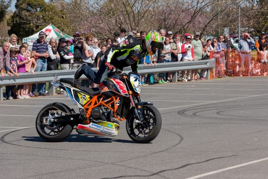 VICTORIA/AUSTRALIA - SEPTEMBER 2015: Stunt motorcycle rider performing at a local car show on the 13 September 2015 in Corowa.