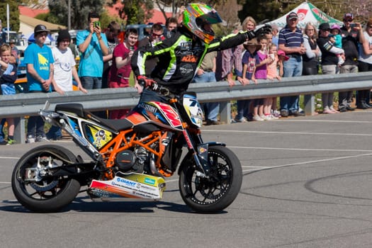 VICTORIA/AUSTRALIA - SEPTEMBER 2015: Stunt motorcycle rider performing at a local car show on the 13 September 2015 in Corowa.