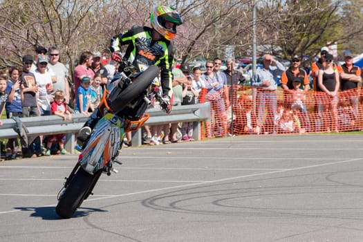 VICTORIA/AUSTRALIA - SEPTEMBER 2015: Stunt motorcycle rider performing at a local car show on the 13 September 2015 in Corowa.