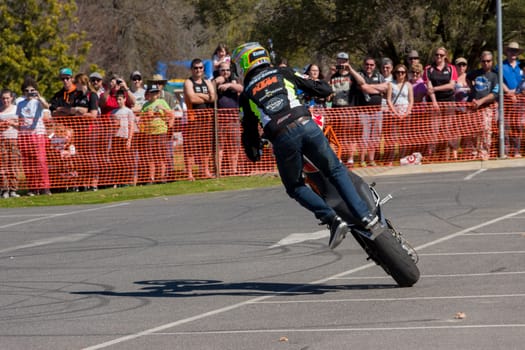 VICTORIA/AUSTRALIA - SEPTEMBER 2015: Stunt motorcycle rider performing at a local car show on the 13 September 2015 in Corowa.