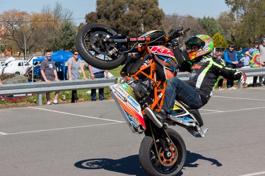 VICTORIA/AUSTRALIA - SEPTEMBER 2015: Stunt motorcycle rider performing at a local car show on the 13 September 2015 in Corowa.