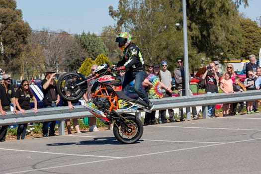 VICTORIA/AUSTRALIA - SEPTEMBER 2015: Stunt motorcycle rider performing at a local car show on the 13 September 2015 in Corowa.