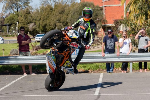 VICTORIA/AUSTRALIA - SEPTEMBER 2015: Stunt motorcycle rider performing at a local car show on the 13 September 2015 in Corowa.