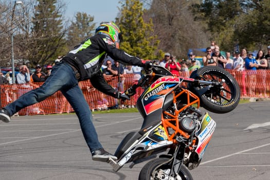 VICTORIA/AUSTRALIA - SEPTEMBER 2015: Stunt motorcycle rider performing at a local car show on the 13 September 2015 in Corowa.