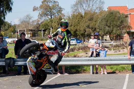 VICTORIA/AUSTRALIA - SEPTEMBER 2015: Stunt motorcycle rider performing at a local car show on the 13 September 2015 in Corowa.