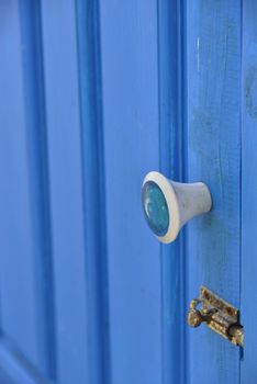 white handle on a blue door ( open up door )