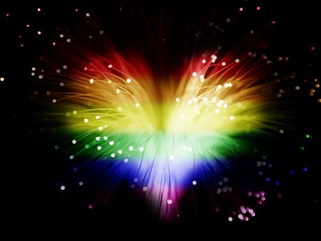 rainbow colored abstract heart made from fibers  lights  in darkness ( love concept )