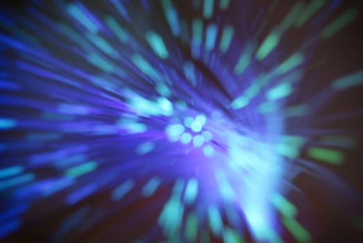 colored particles fly in space of the optical fiber and circling ( abstract blur background  )