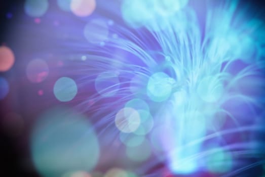 colored bokeh  particles fly in space of the optical fiber and circling ( abstract blur background  )