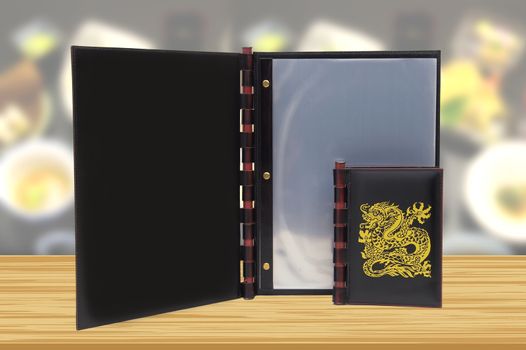 black  leather Japanese menu with a picture of the dragon in a restaurant or cafe