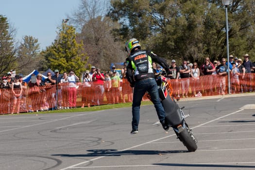 VICTORIA/AUSTRALIA - SEPTEMBER 2015: Stunt motorcycle rider performing at a local car show on the 13 September 2015 in Corowa.