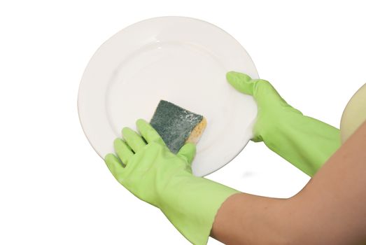 hands in green gloves wash  white plate