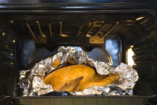 cooking juicy golden chicken in oven and foil 