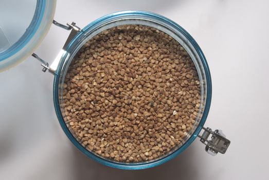 buckwheat in protected food container over white