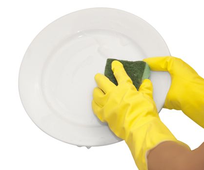 hands in yellow gloves wash  white plate