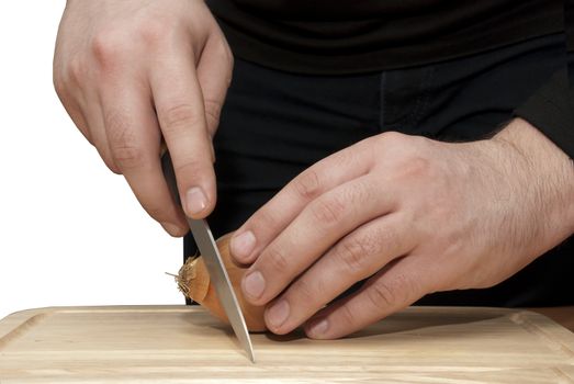 men hands cut onion on  cutting board