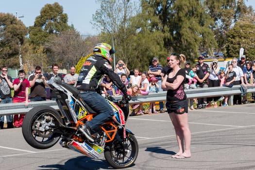 VICTORIA/AUSTRALIA - SEPTEMBER 2015: Stunt motorcycle rider performing at a local car show on the 13 September 2015 in Corowa.