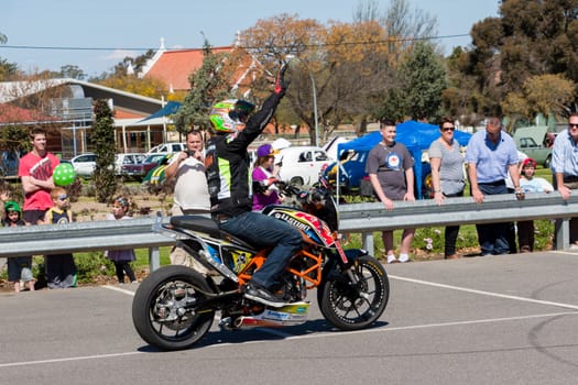 VICTORIA/AUSTRALIA - SEPTEMBER 2015: Stunt motorcycle rider performing at a local car show on the 13 September 2015 in Corowa.