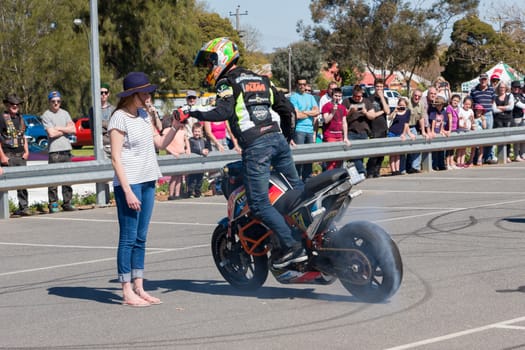 VICTORIA/AUSTRALIA - SEPTEMBER 2015: Stunt motorcycle rider performing at a local car show on the 13 September 2015 in Corowa.