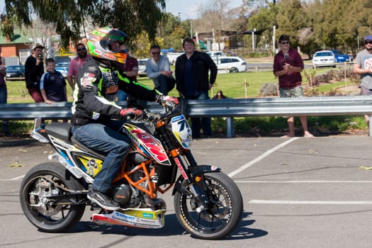 VICTORIA/AUSTRALIA - SEPTEMBER 2015: Stunt motorcycle rider performing at a local car show on the 13 September 2015 in Corowa.