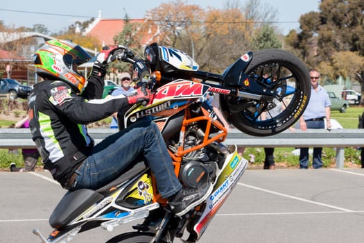 VICTORIA/AUSTRALIA - SEPTEMBER 2015: Stunt motorcycle rider performing at a local car show on the 13 September 2015 in Corowa.