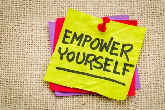 empower yourself reminder - motivational text on a sticky note