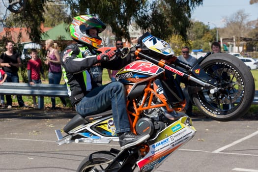 VICTORIA/AUSTRALIA - SEPTEMBER 2015: Stunt motorcycle rider performing at a local car show on the 13 September 2015 in Corowa.