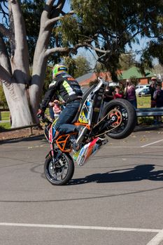 VICTORIA/AUSTRALIA - SEPTEMBER 2015: Stunt motorcycle rider performing at a local car show on the 13 September 2015 in Corowa.