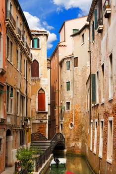 Romantic view of Venice with a canal, small bridge and old houses. Venezia (UNESCO world heritage site), Veneto, Italy