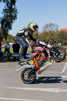 VICTORIA/AUSTRALIA - SEPTEMBER 2015: Stunt motorcycle rider performing at a local car show on the 13 September 2015 in Corowa.