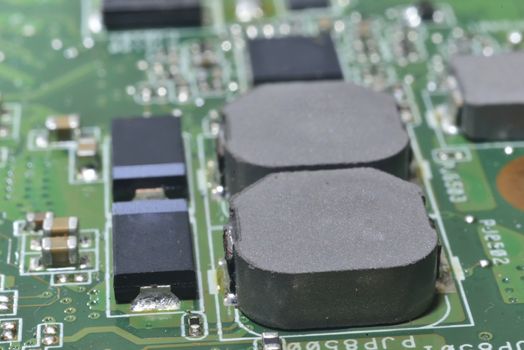 macro zoomed capacitors and chips on matherboard