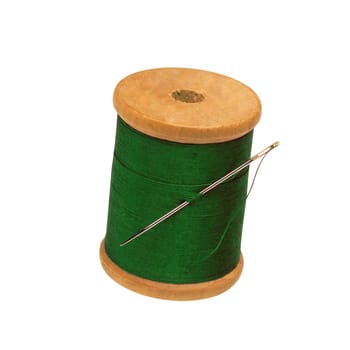 Spool of thread and needle isolated