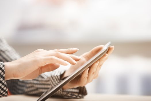 Businesswoman at office working with digital tablet
