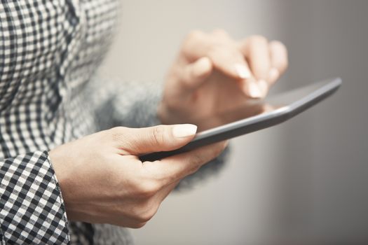 Womanworking with digital tablet. Close-up horizontal photo