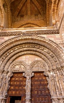 Cathedral Door Avila Castile Spain  Gothic church built in the 1100s.  Avila is a an ancient walled medieval city in Spain.  