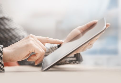 Businesswoman at office working with digital tablet
