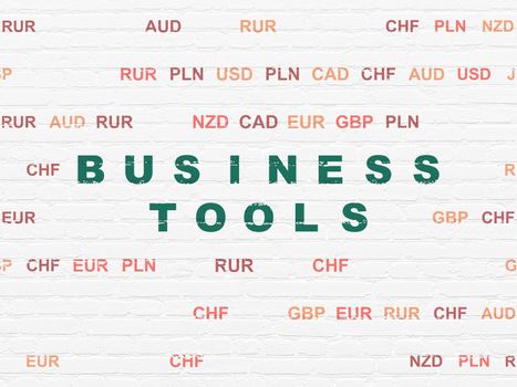 Finance concept: Painted green text Business Tools on White Brick wall background with Currency