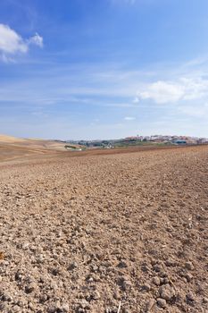 Plowed Field on the Background of the Small Spanish City