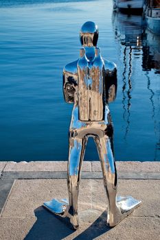 OSLO - MARCH 21: Contemporary scuplture of a diverr in Oslo harbour