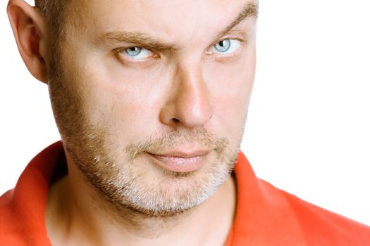 strict unshaven man on a white background. face close up