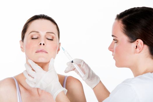 doctor gets botox injection to a woman patient