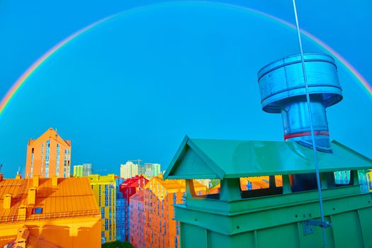 Double rainbow over bright colored houses. Kiev city