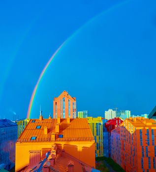 Double rainbow over bright colored houses. Kiev city